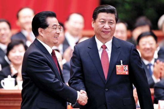 President Xi Jinping is congratulated by his predecessor Hu Jintao after his election at the fourth plenary meeting of the first session of the 12th National People\'s Congress on Thursday in Beijing. [Wu Zhiyi / China Daily]
