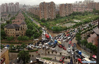 Typhoon Fitow-triggered downpours lash E. China