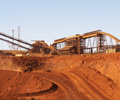 China iron ore futures tick higher, glut caps rise
