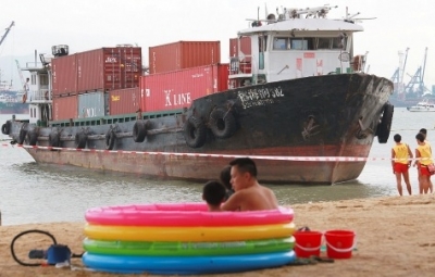 Chinese feeder forced ashore on Hong Kong beach