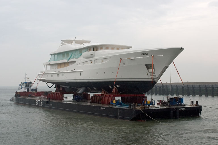 Amels #454 loaded on a pontoon
